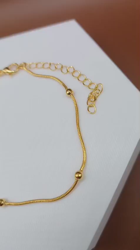 Tornozeleira Esferas